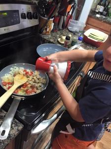 Cooking and seasoning the veggies. 