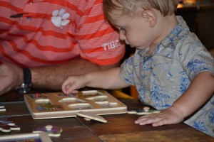 Henry works his transportation puzzle.